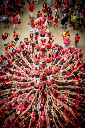 The Castellers from Barcelona about to crown a 4d8a during the Tarragona Human Tower Competition. – © David Oliete