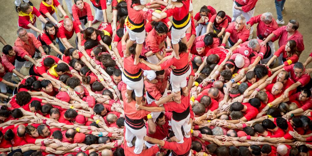 The Castellers from Barcelona about to crown a 4d8a during the Tarragona Human Tower Competition. – © David Oliete