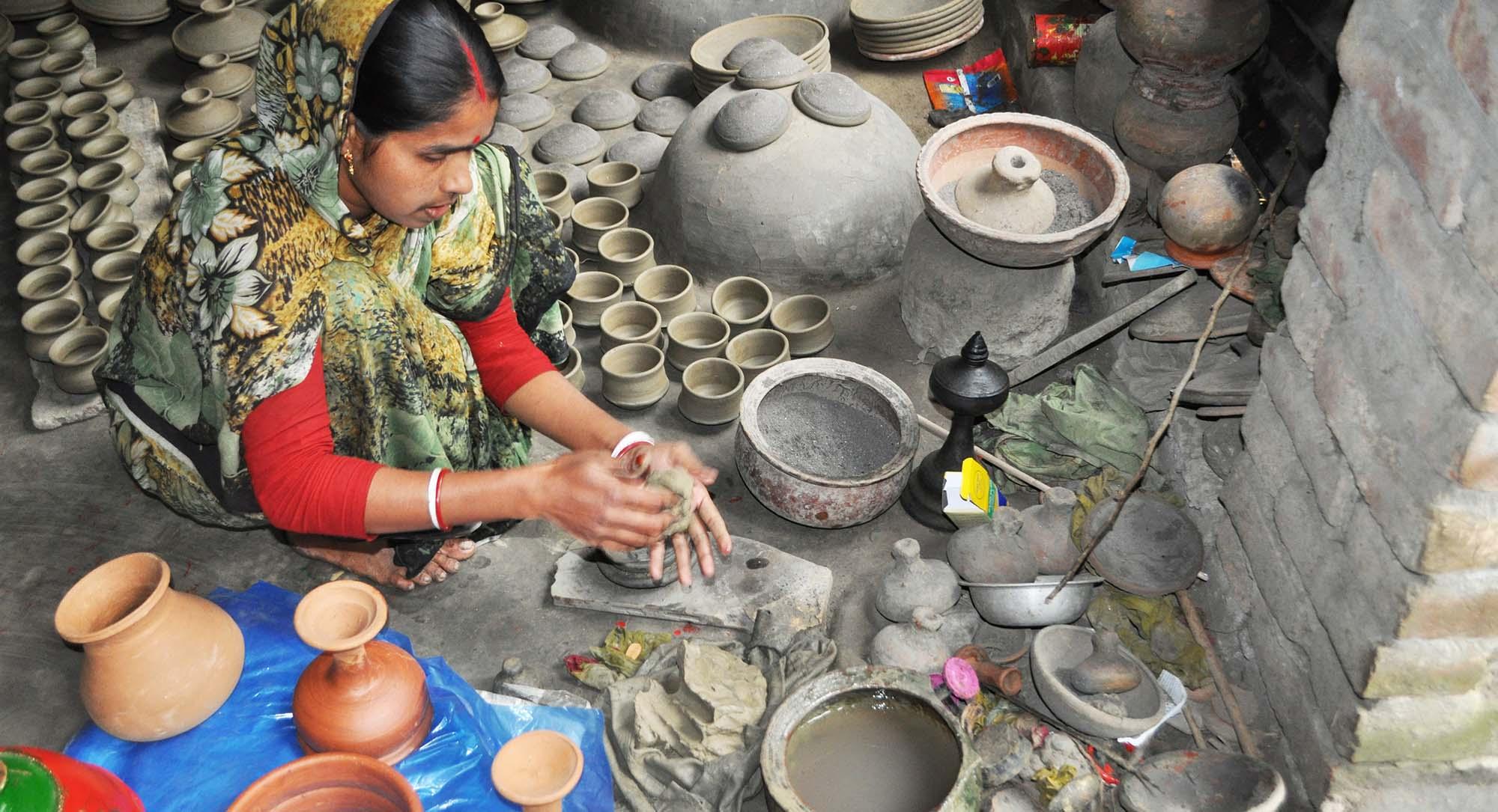 Member of pottery-making community moulding refined mud to create a handmade terracotta bowl, Palpara Paharpur – © Roni Kabir Nurul