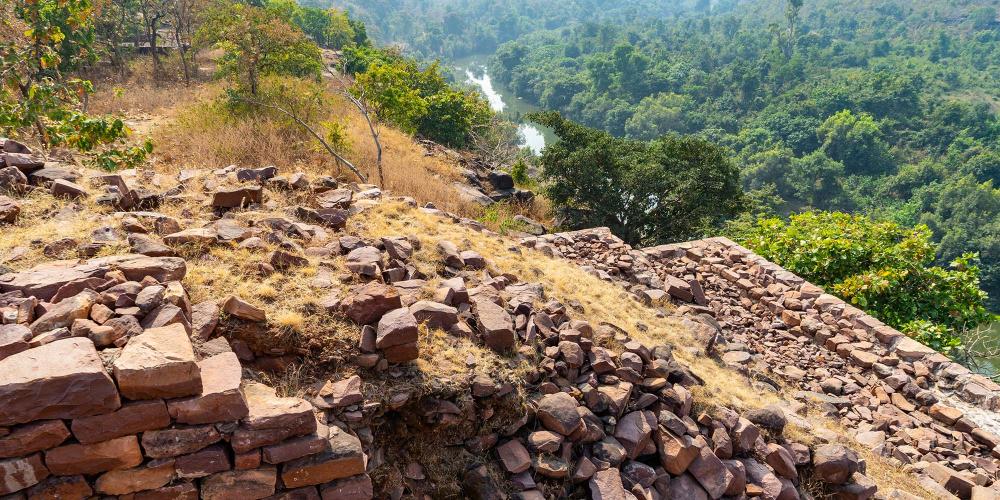 An excavated monastery at Satdhara that has views down to the nearby river and across the valley. – © Michael Turtle