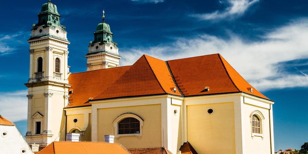 A picturesque small town with a long history, Valtice was first mentioned in 1192. From 1394 until 1939, it served as the Liechtenstein Dynasty's residence. There is a Baroque parish church (pictured) on the square and other historical sites in town. – © ZM_Photo / Shutterstock