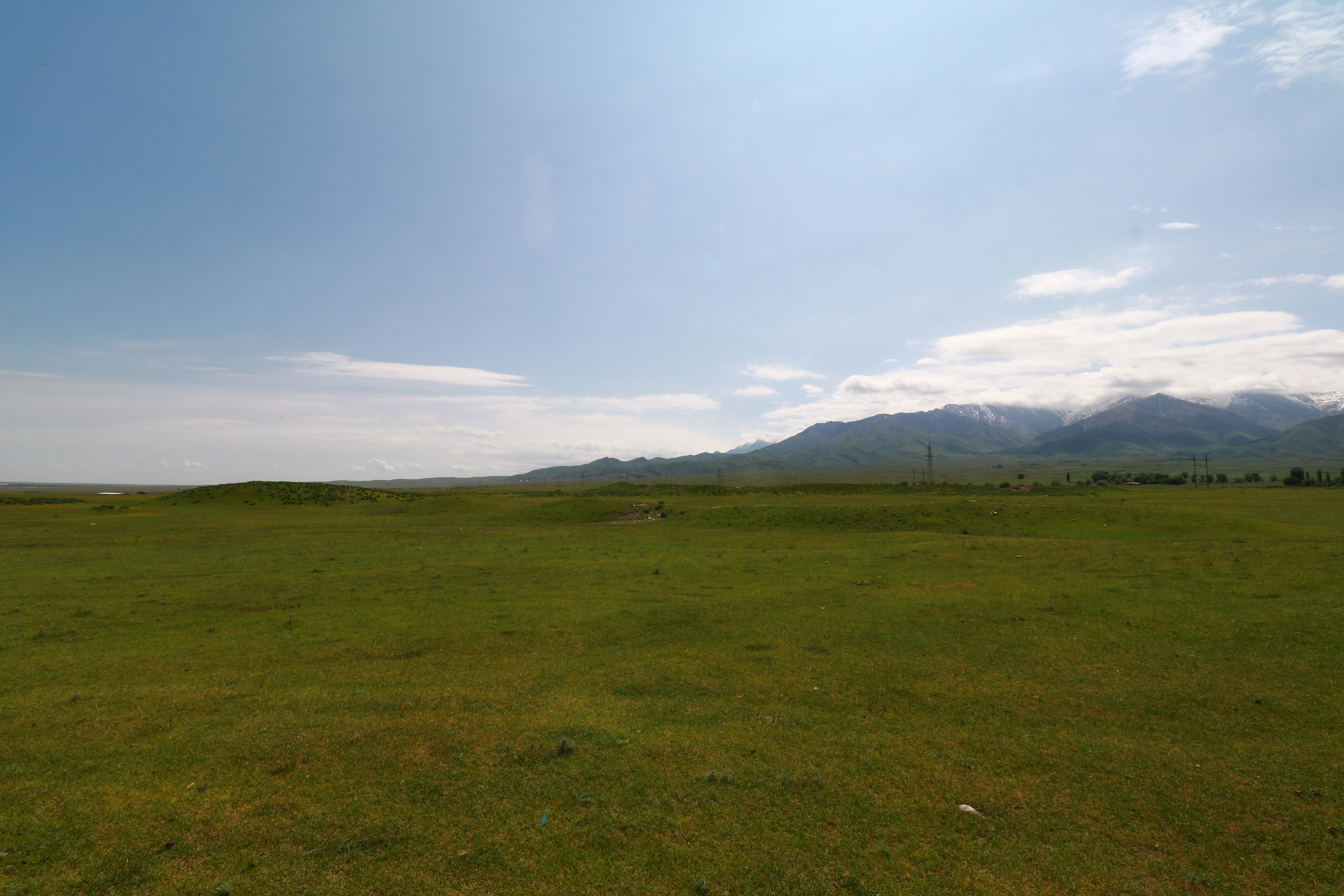 Ornek lies on a grassy plain at the foot of the mountains © Site of Ornek