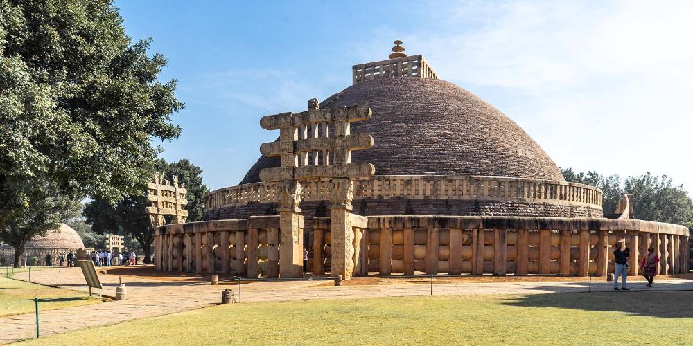 The view of the Great Stupa from the western side, with one of the four decorated gateways. – © Michael Turtle