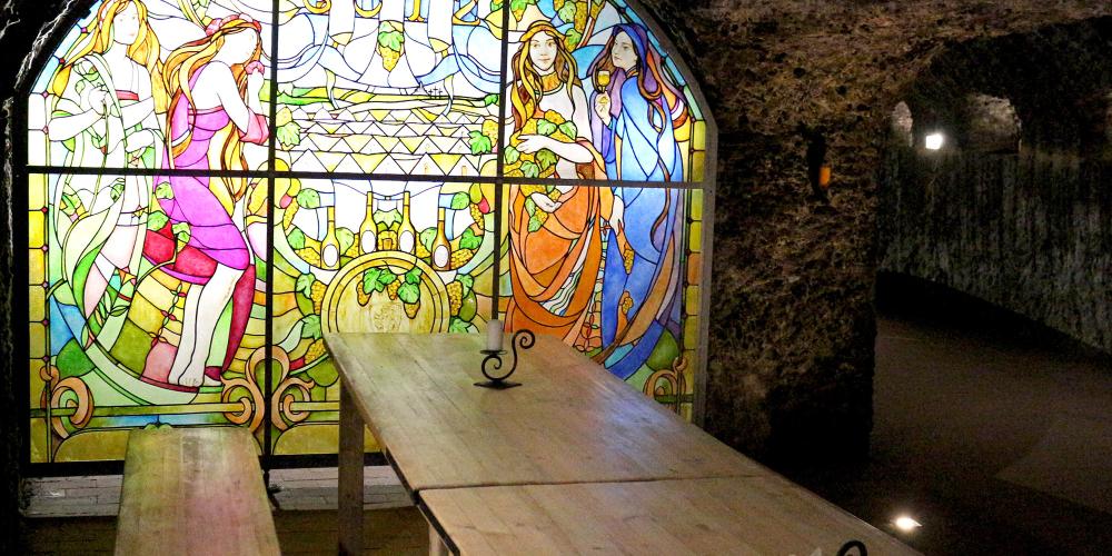 Tasting cellar at Hercegkút Gomboshegy - with decorative painted interior stained glass windows. There are several vintage wines to taste here with Swabian bacon or pike. The local speciality is a thick stew that is served with homemade bread and sour cabbage. – © László Horváth Tasting cellar at Hercegkút Gomboshegy - with decorative painted interior stained glass windows. There are several vintage wines to taste here with Swabian bacon or pike. The local speciality is a thick stew that is served with homemade bread and sour cabbage. – © László Horváth