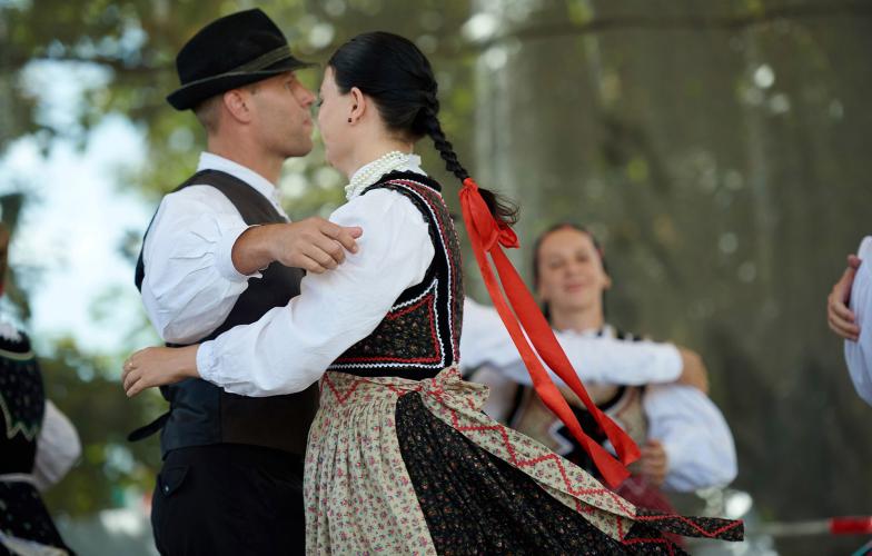 A couple dance the Csárdás, the national dance of Hungary. It's a courting dance for couples that begins with a slow section (lassu) followed by an exhilarating fast section (friss). – © Kornél Kertész