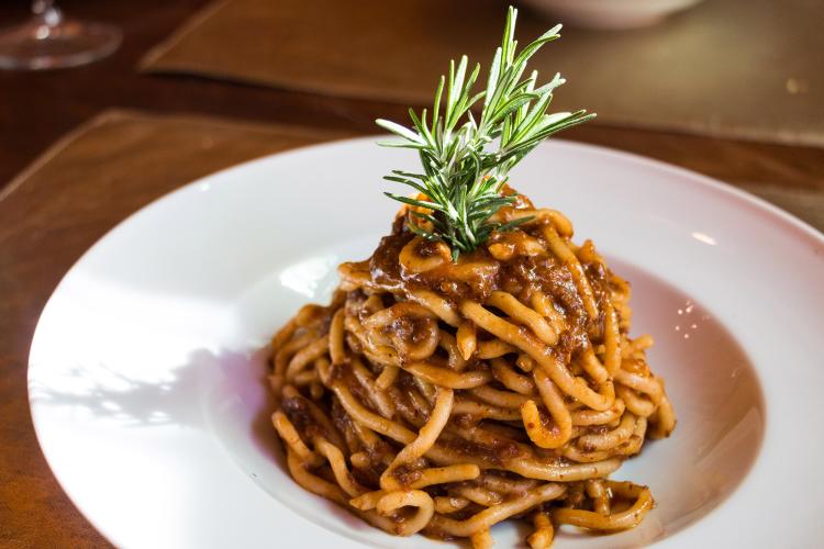 Pici with wild boar sauce. Pici are typical spaghetti only from this region and wild boar is a typical meat. It's very tasty! – © Tina Fasulo / Share your Sangi