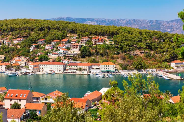 The town of Jelsa is surrounded by thick pine forests and tall poplar trees. It has a relaxed village atmosphere based around a once-prosperous port. – © zstock / Shutterstock