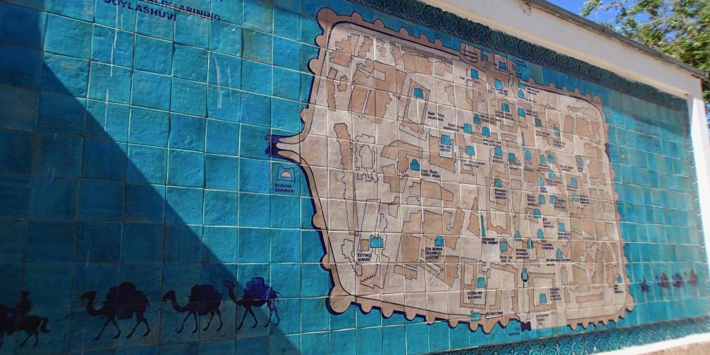 The map of town-fortress of Khiva on glazed tiles showing iconic historical and architectural monuments – Photo by Helen Turner The map of town-fortress of Khiva on glazed tiles showing iconic historical and architectural monuments – Photo by Helen Turner