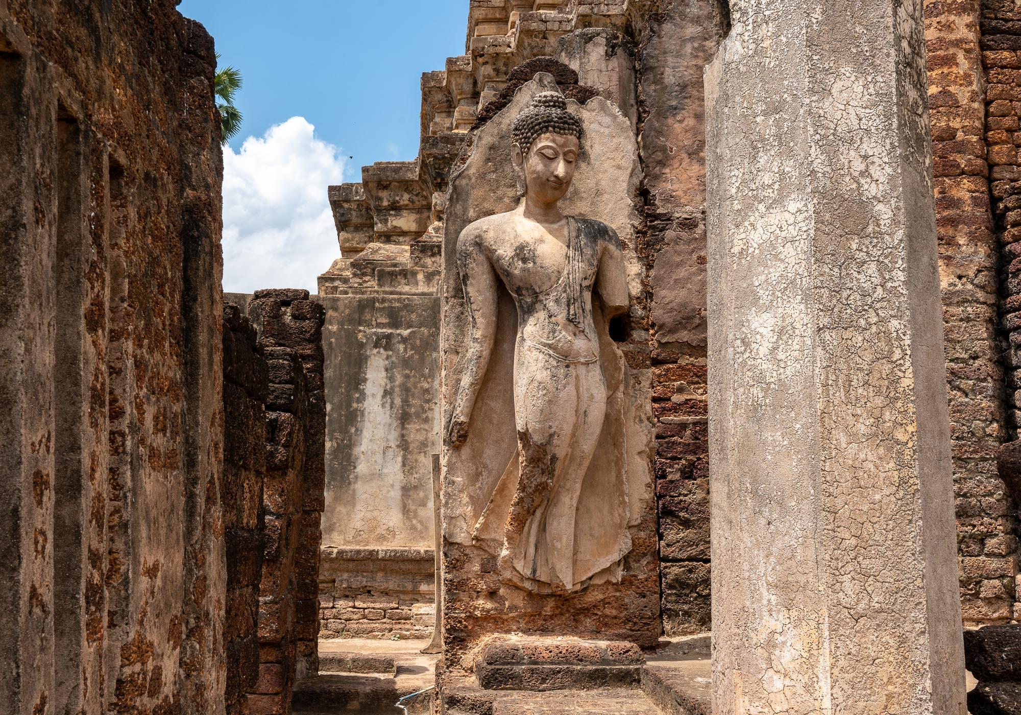 The famous statue of a smiling walking Buddha, which is one of Si Satchanalai's most important artworks. – © Michael Turtle
