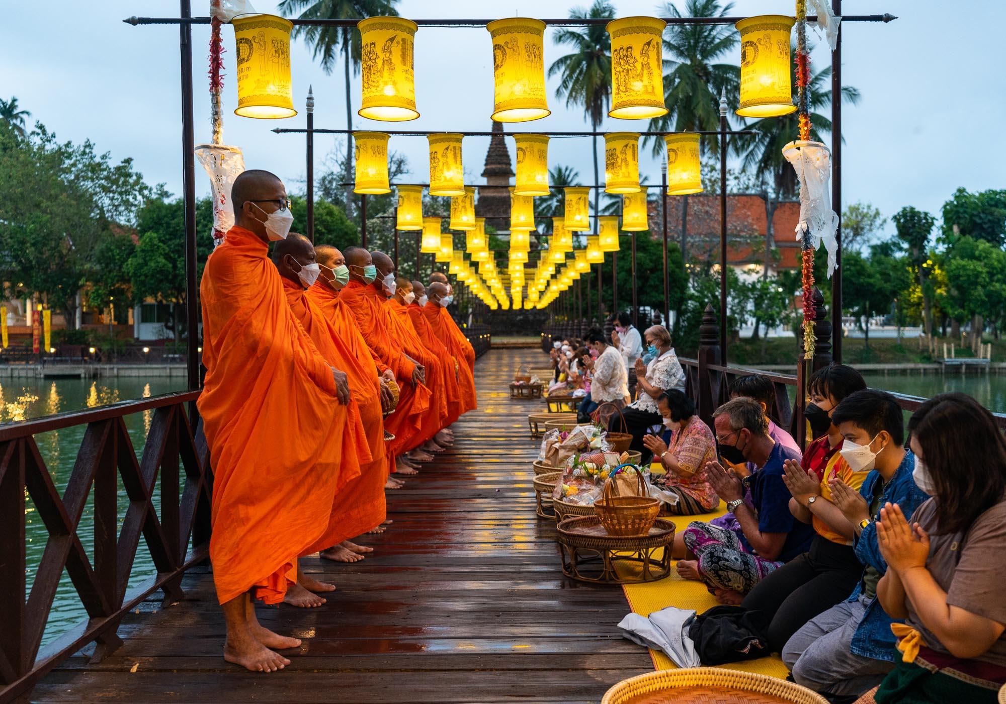 The gathering of monks for morning alms at Wat Traphang Thong is an authentic experience, even though it's been arranged partly for tourists. – © Michael Turtle