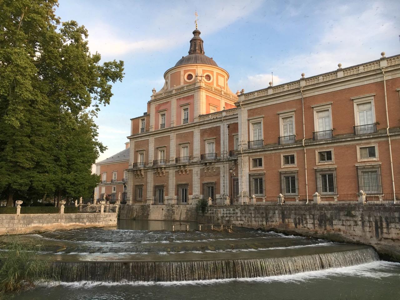 View of the Royal Palace of Aranjuez from the Island Garden, overlooking Castañuelas Waterfall. – © Frank Biasi