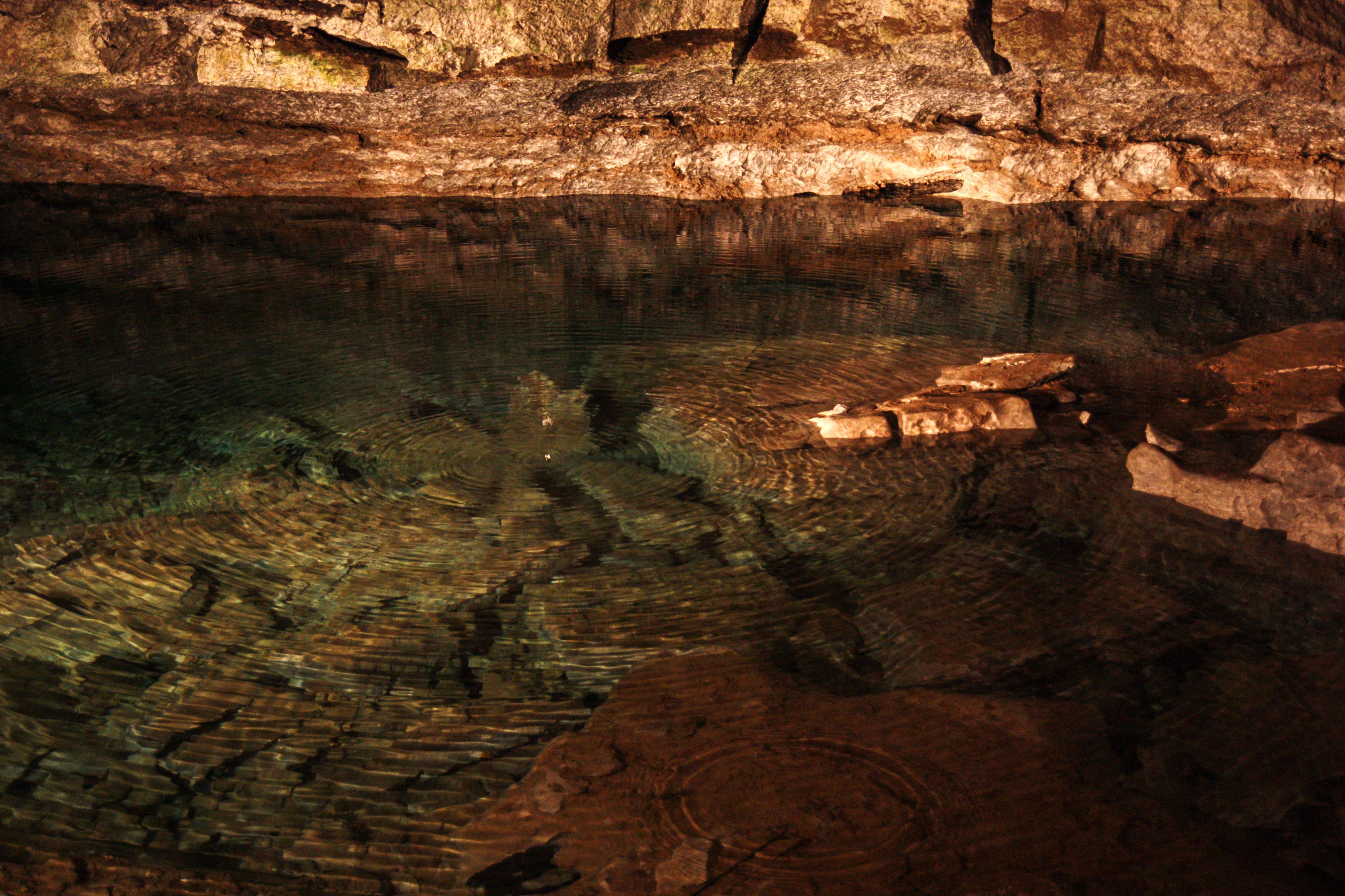 The clear waters of the underground lake are both refreshing, and, potentially, curative.