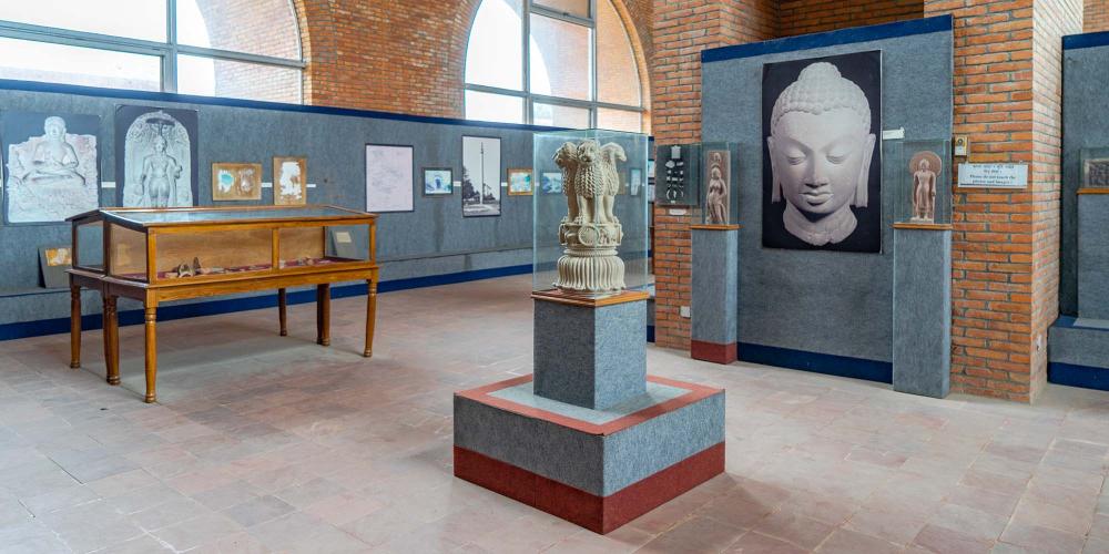 One of the rooms in the Lumbini Museum, showing examples of Buddhist art from across the world. – © Michael Turtle