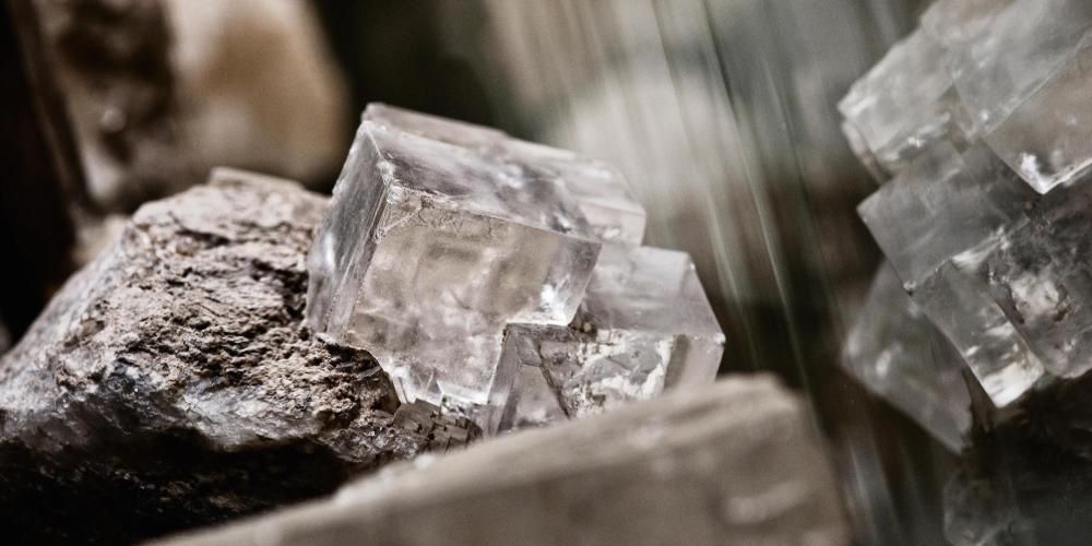 Halite crystal from the Wieliczka Salt Mine. The name derives from Greek words halos - salt, salty and lithos - rock. Mineral indispensable for human life. – © Aleksandra Zapolska Halite crystal from the Wieliczka Salt Mine. The name derives from Greek words halos - salt, salty and lithos - rock. Mineral indispensable for human life. – © Aleksandra Zapolska