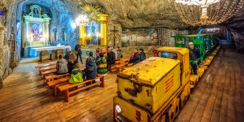Underground tourist rail tracks in the Bochnia Salt Mine - the only rail track in the world that passes through a chapel interior. – © Adam Brzoza Underground tourist rail tracks in the Bochnia Salt Mine - the only rail track in the world that passes through a chapel interior. – © Adam Brzoza