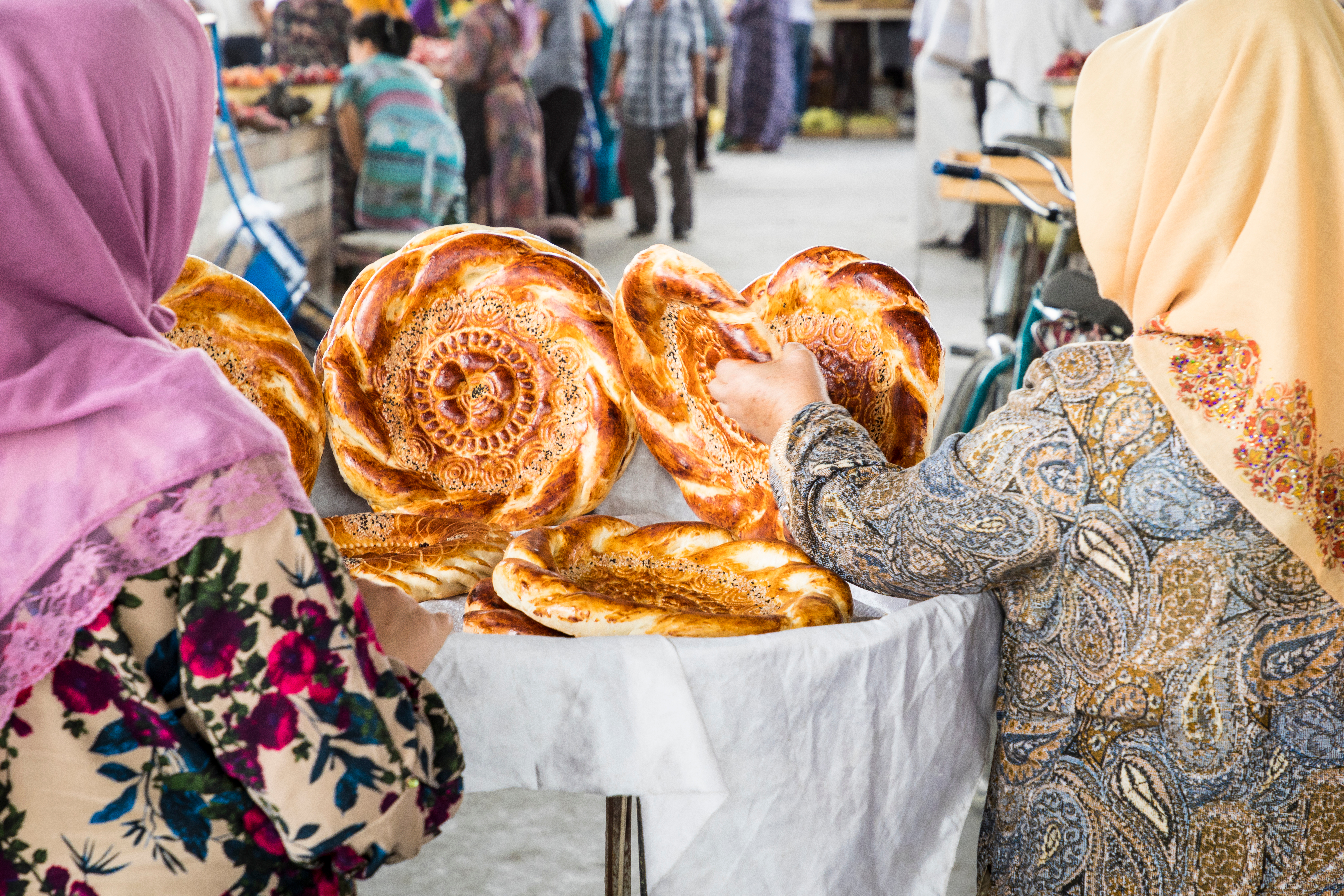 Women buying traditional bread