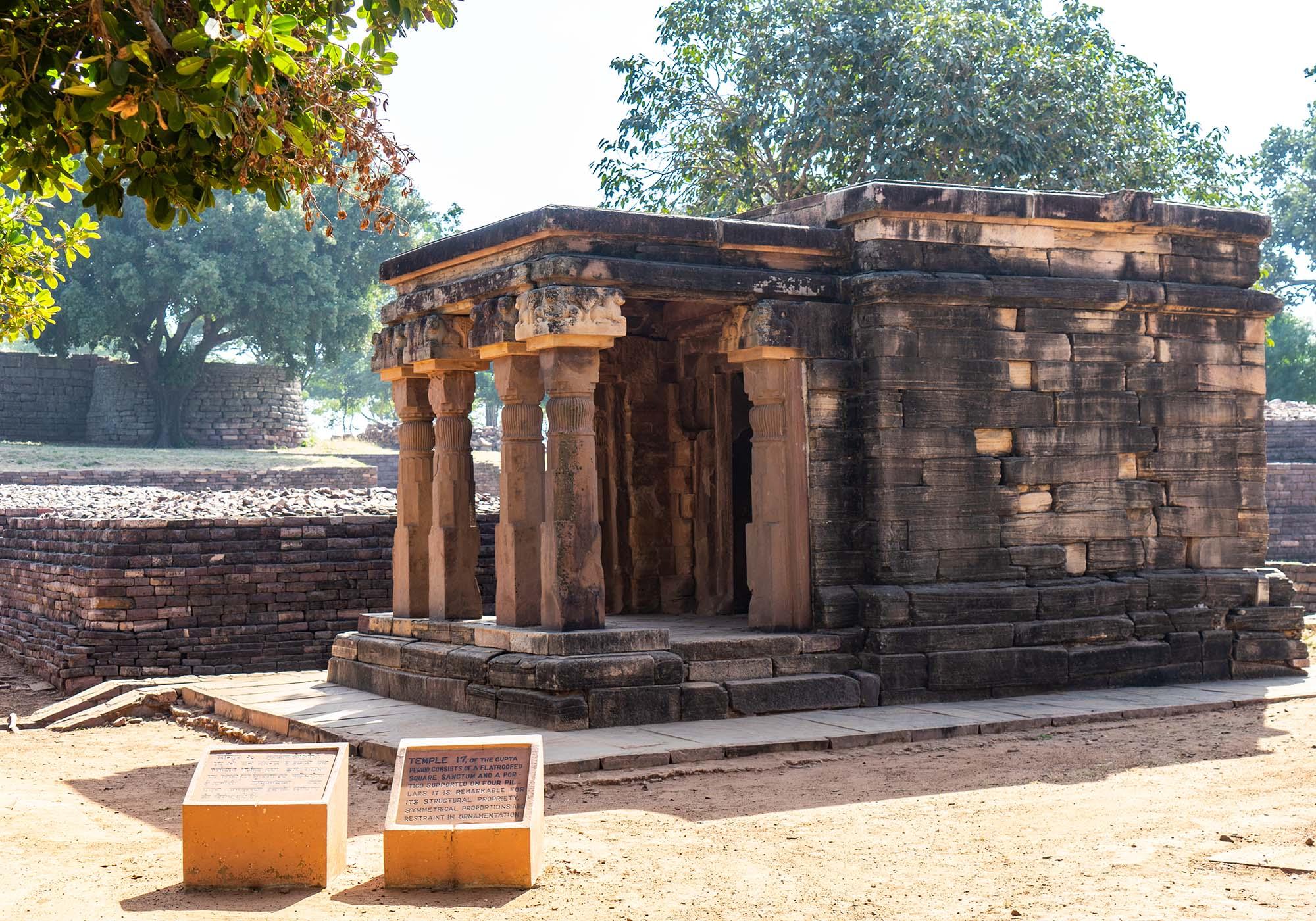 Temple 17 on the main terrace at Sanchi consists of a flat-roofed square sanctum with a portico supported on four pillars in the front. – © Michael Turtle