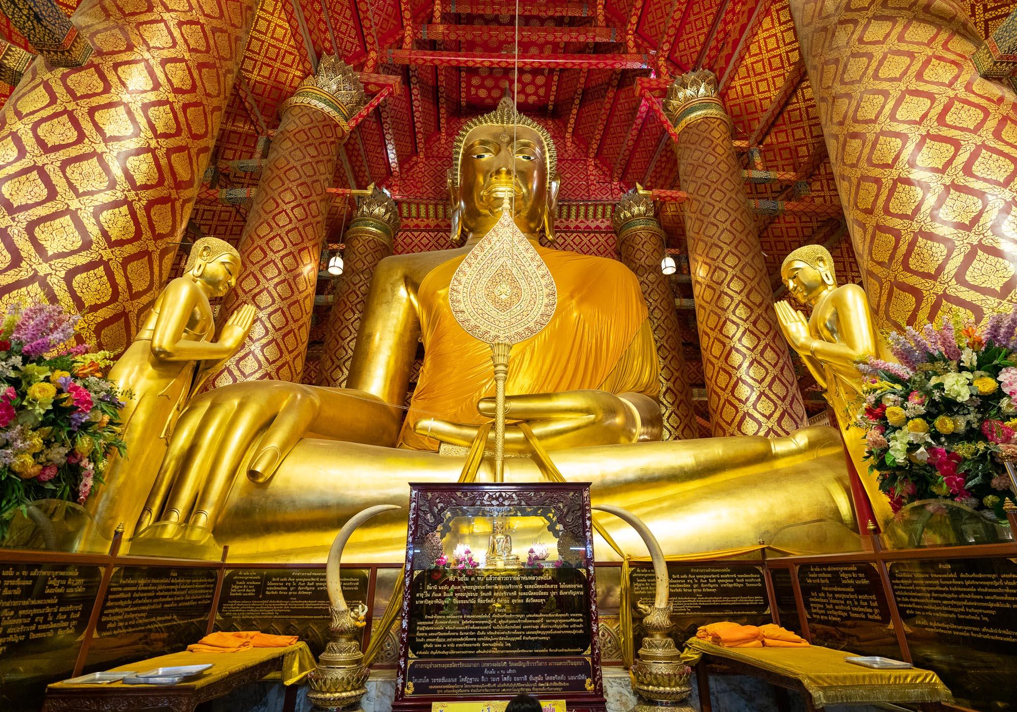 The 19-metre-high gold-covered Buddha statue in Wat Phanan Choeng, one of the most popular sites for worship in the city. – © Michael Turtle