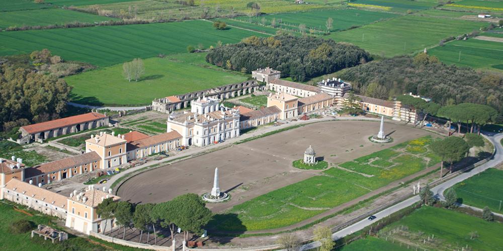 Aerial Photo of the sober and elegant central architectural complex of neoclassical style and dependencies. – © Emma Taricco