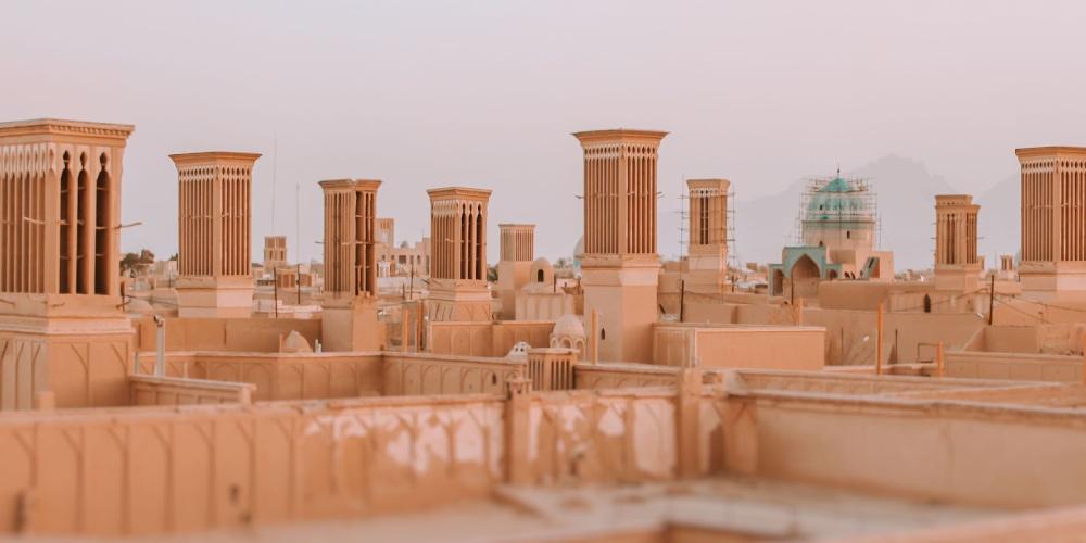 Countless wind towers can be seen from roofs all around the city. Designed to cool the desert homes, the wind towers are like ancient air conditioners. – © Mohamed416 / Shutterstock