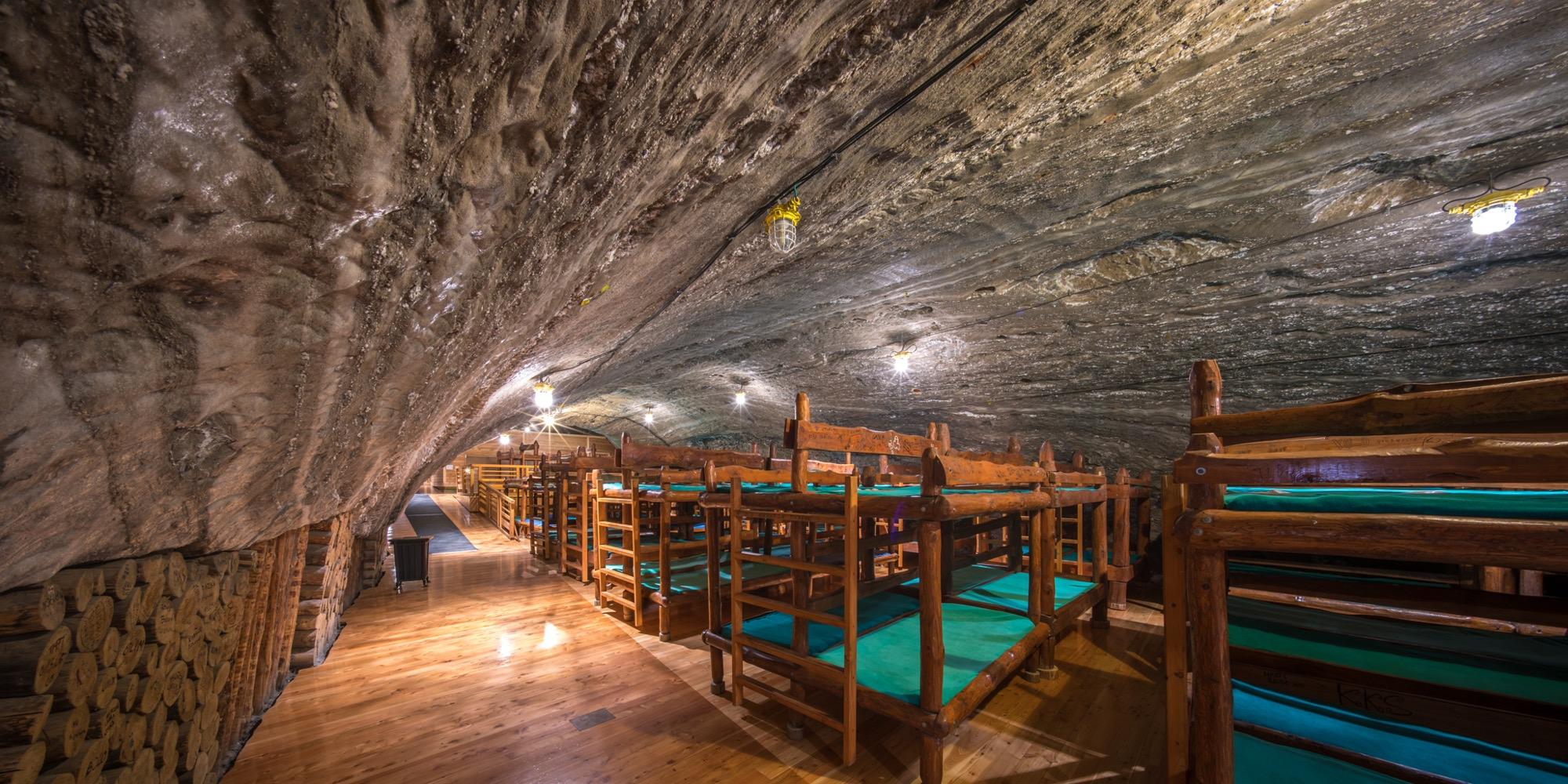 Overnight stays at Bochnia Salt Mine take place in the largest of the chambers, the Ważyn—located 250 meters underground—with 232 beds, a restaurant, and recreational facilities including a sports field, a playground, and a conference room. – © Adam Brzoza
