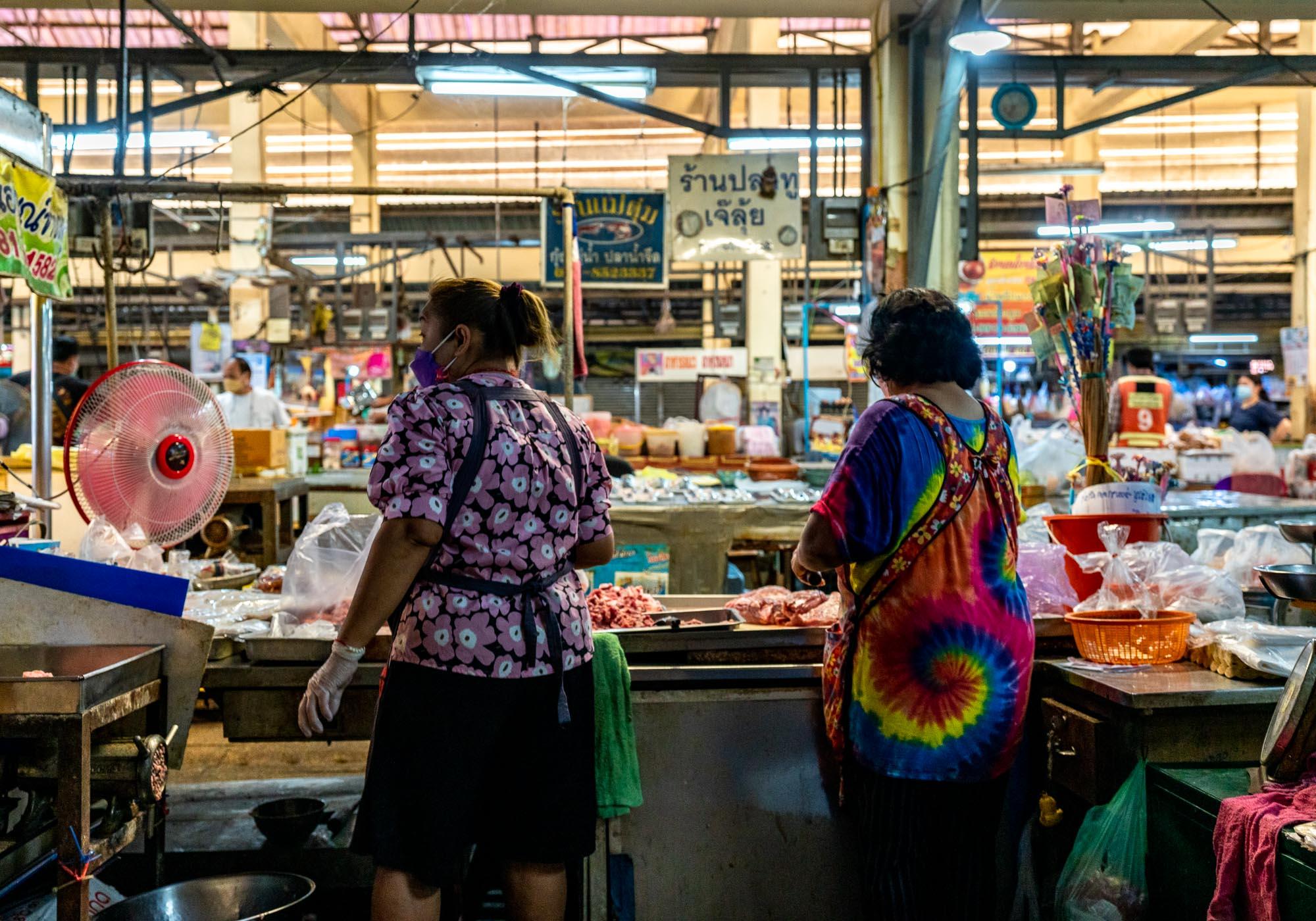 The food area of the Hua Ro Market is busy in the mornings as locals come to buy ingredients for the day's cooking. – © Michael Turtle