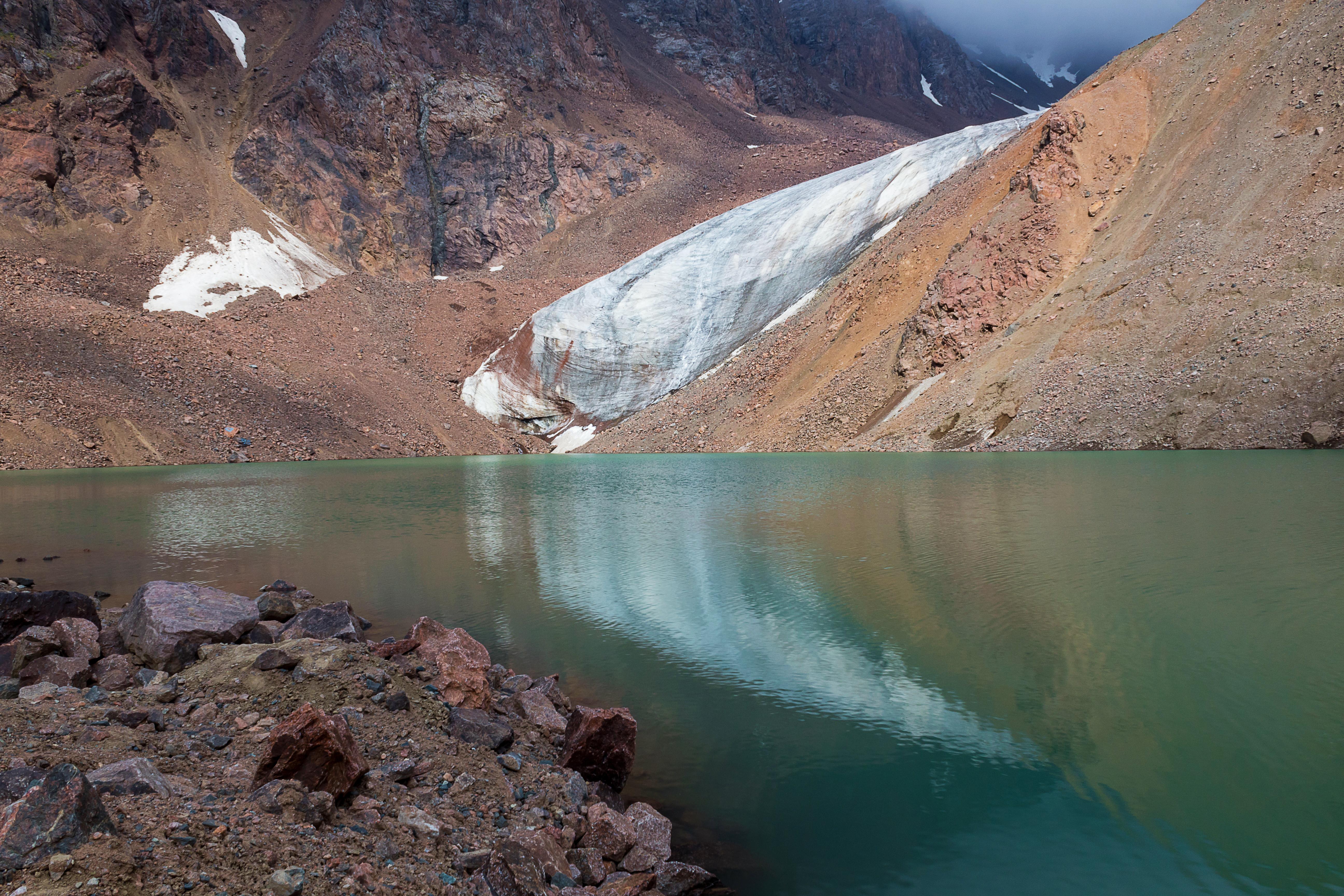 Manshuk Mametova lake with melting snow