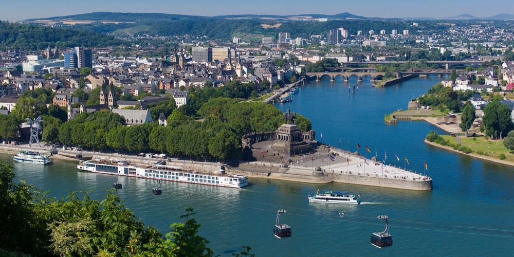 “Deutsches Eck” (German Corner) is Germany's best-known river confluence. This is where “Old Father Rhine” meets “Mother Moselle.” It's also the starting point for the cable car to the Ehrenbreitstein Fortress. – © Herbert Piel / Piel Media, Rheintouristik Tal der Loreley “Deutsches Eck” (German Corner) is Germany's best-known river confluence. This is where “Old Father Rhine” meets “Mother Moselle.” It's also the starting point for the cable car to the Ehrenbreitstein Fortress. – © Herbert Piel / Piel Media, Rheintouristik Tal der Loreley