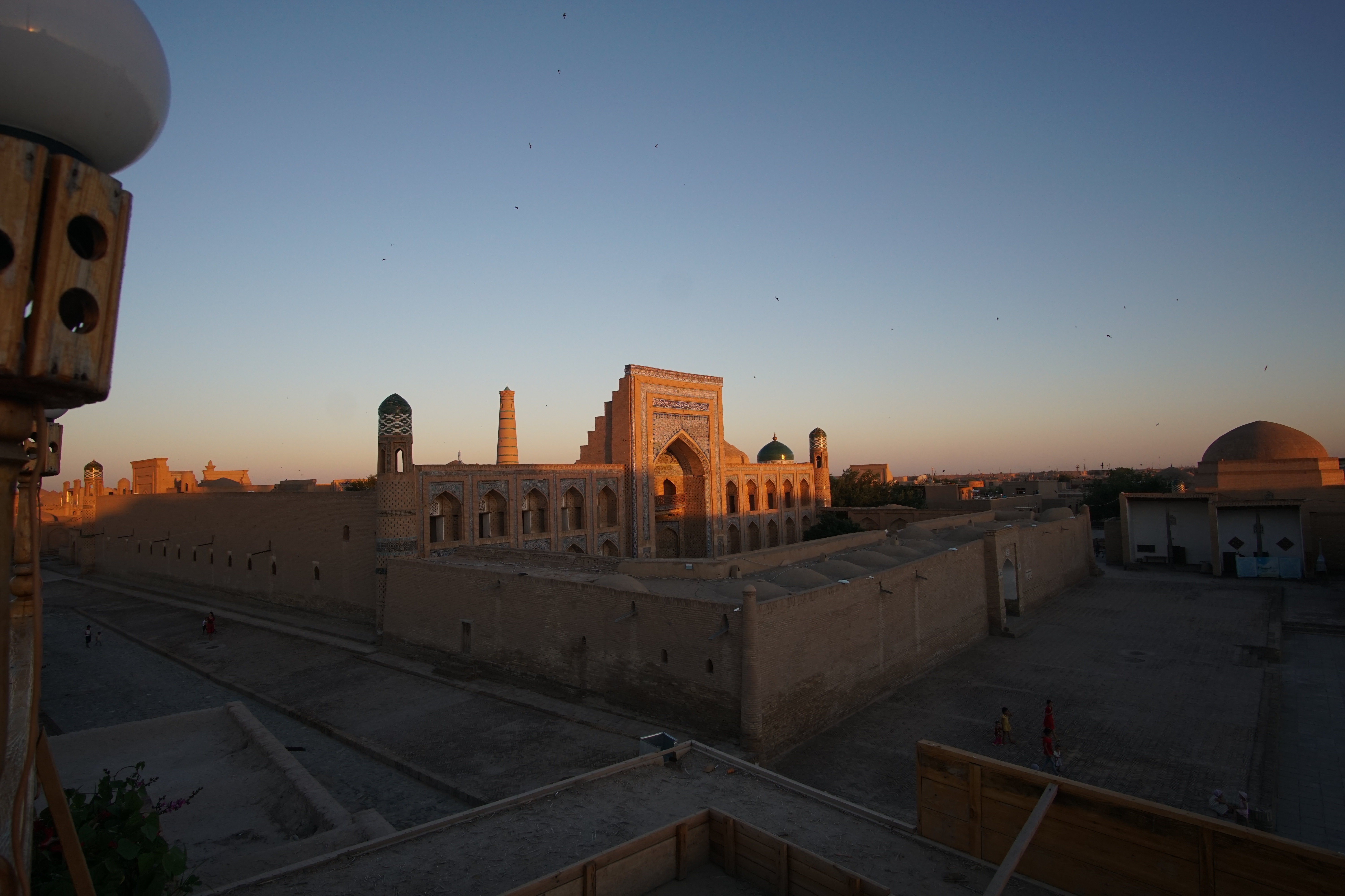 Side view of Mohammed Rahim Khan Medresa at Itchan Kala, the old town of Khiva. A UNESCO heritage site in Uzbekistan – Photo by Cherry Kan