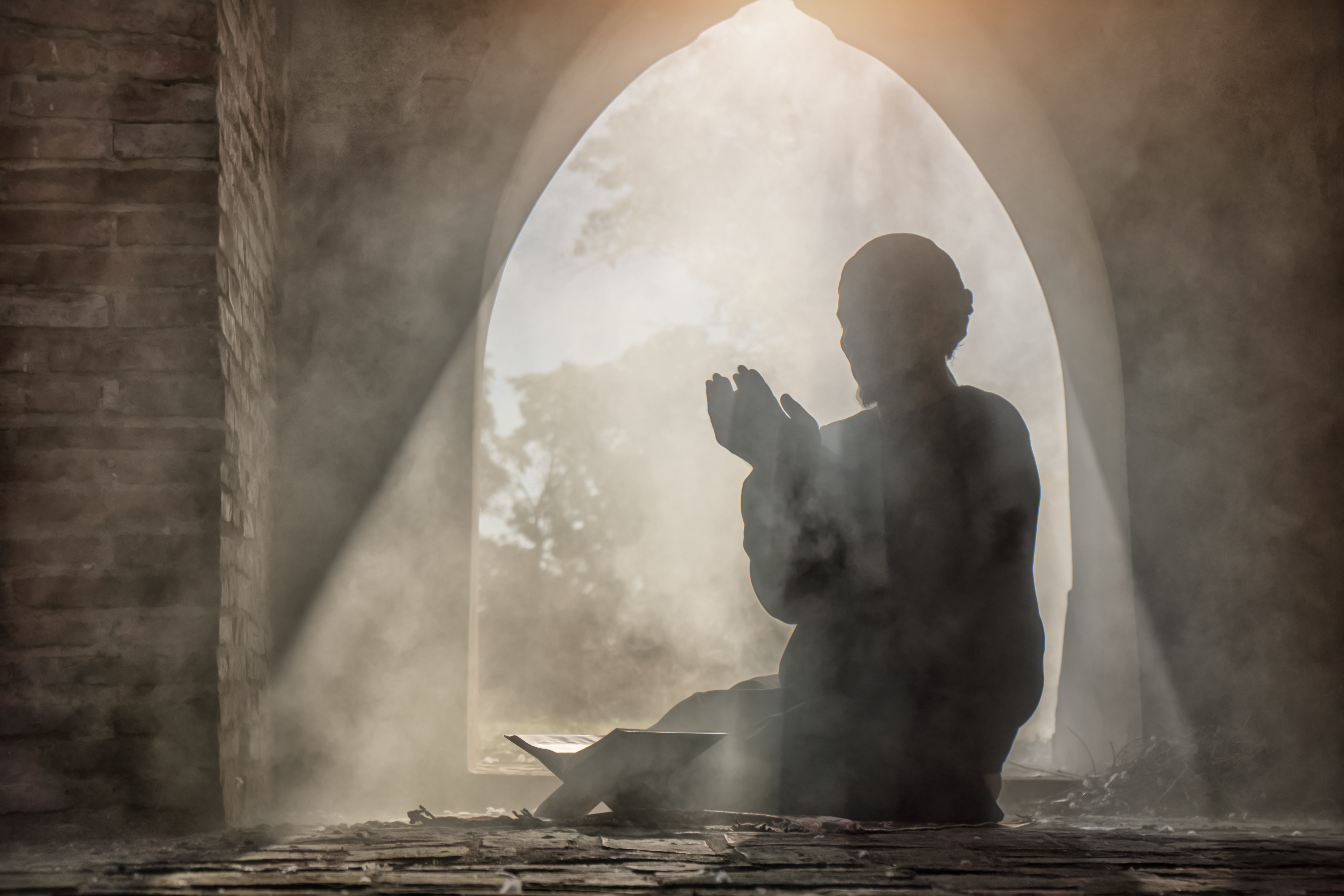an adherent reciting the Quran – © Mongkolchon Akesin / Shutterstock