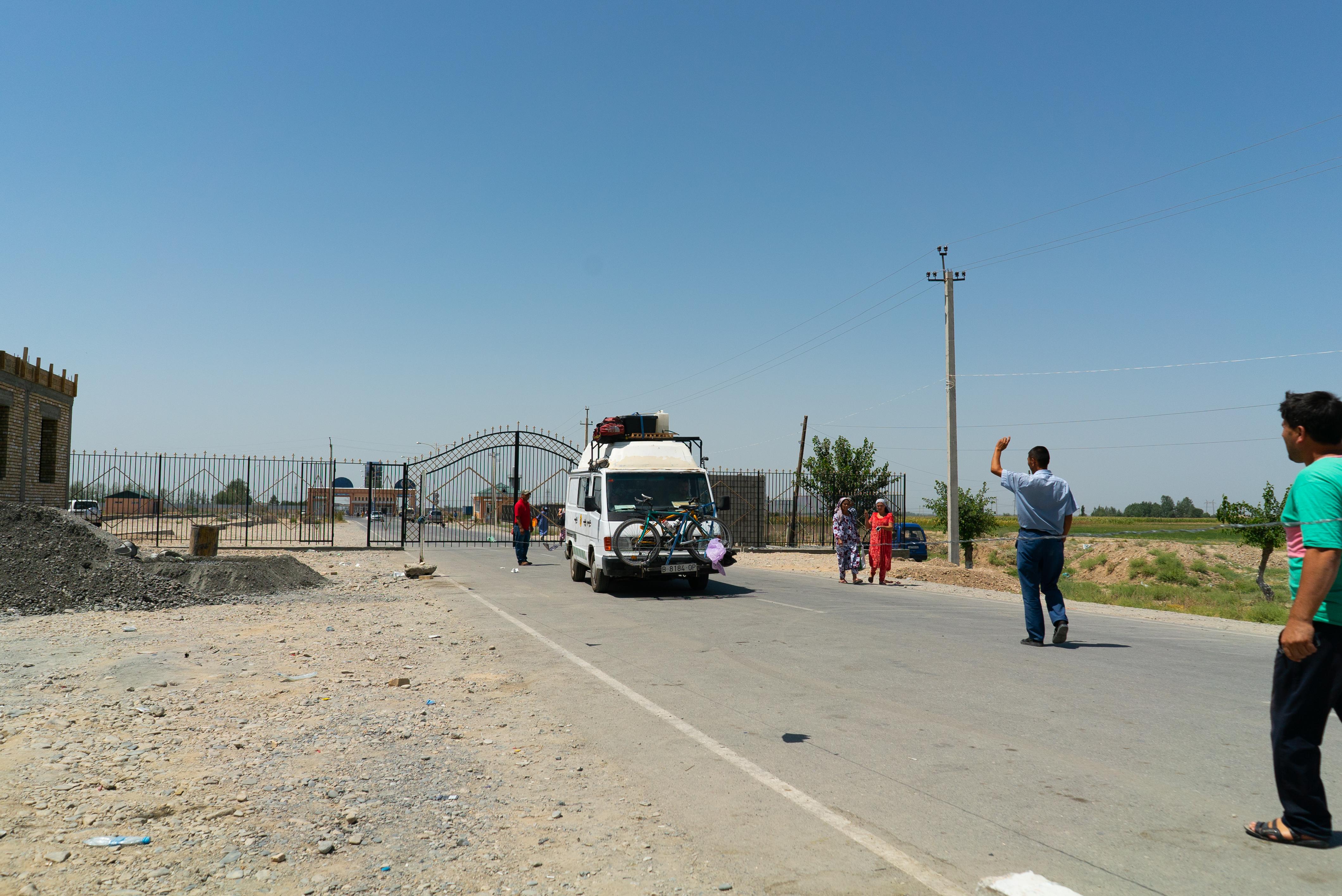 People crossing the border in Tajikistan - Photo by illpaxphotomatic / Shutterstock.com