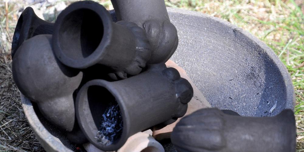 Clay pipes after being baked are placed in a clay bowl. – © Lubo Lužina Clay pipes after being baked are placed in a clay bowl. – © Lubo Lužina