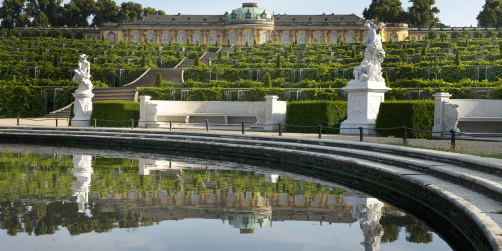 Sanssouci Park is an ensemble of palaces and garden complexes, which
were built under Frederick the Great during the 18th century and were
expanded under Frederick William IV in the 19th century. Sanssouci Palace,
the summer residence of Frederick the Great, is its main focus. – © L.Seidel/SPSG