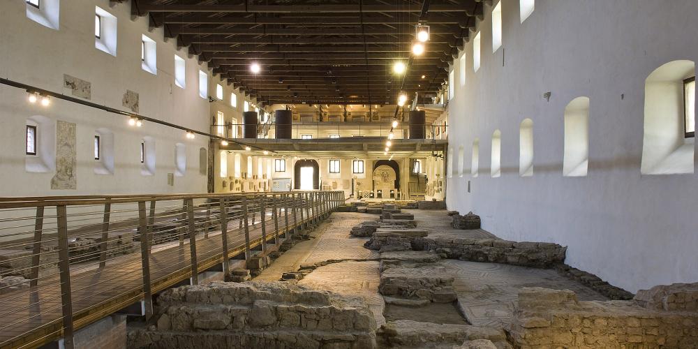 The Early Christian Museum is a combination between a museum and an archaeological site, as visitors are offered the chance to admire the remains of an Early Christian basilica on top of which the modern building was raised. – © Gianluca Baronchelli