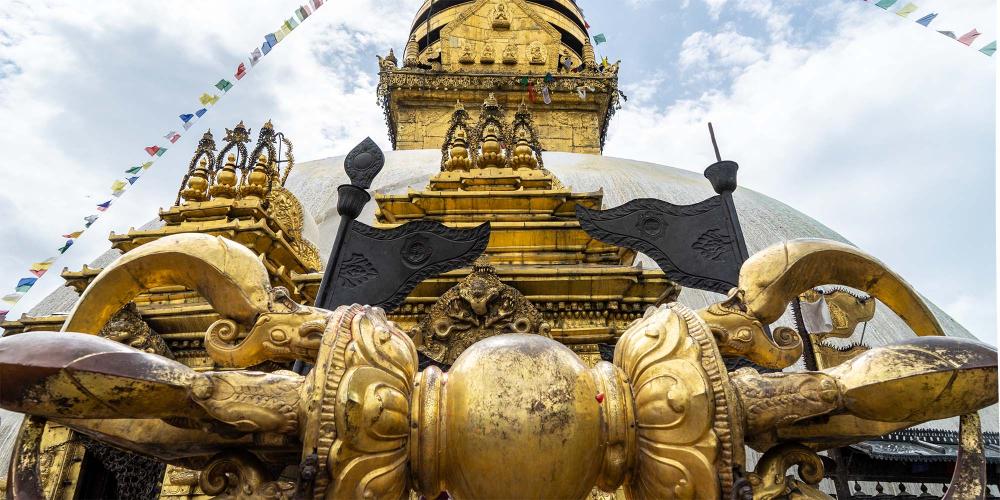 The golden ‘vajra’, or thunderbolt, at the front of the main stupa represents enlightenment and indestructibility. – © Michael Turtle
