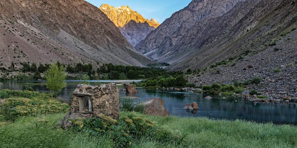 View by a glacier lake of the mountains' slopes. – © Tajikistan National Park View by a glacier lake of the mountains' slopes. – © Tajikistan National Park