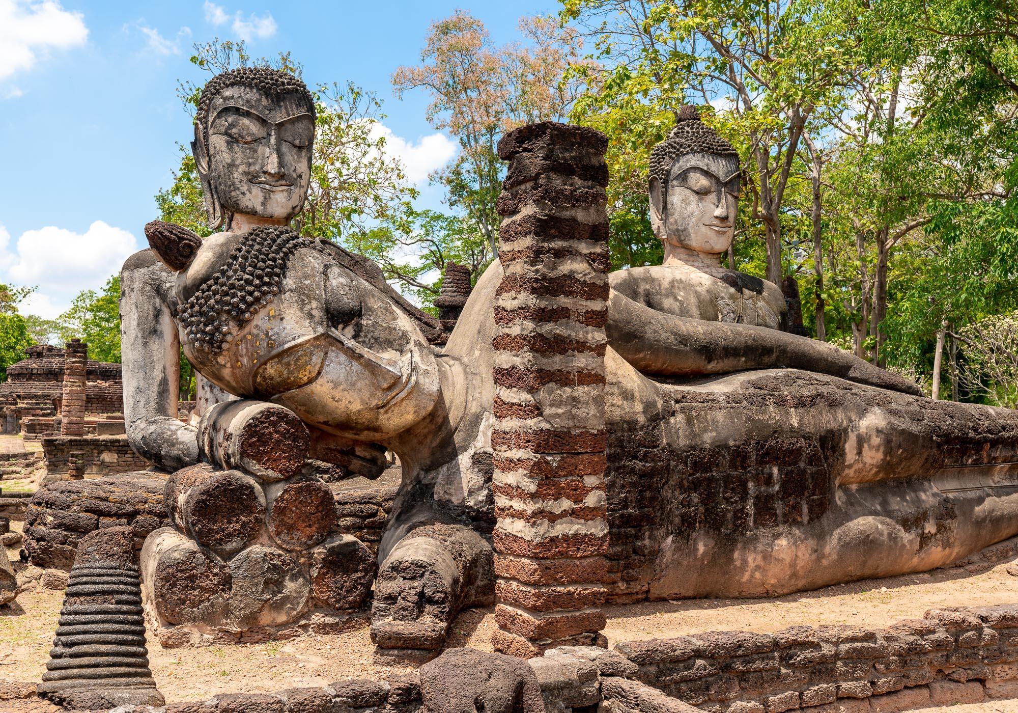 An ensemble of three Buddha statues on one of the pagodas of Wat Phra Kaeo. – © Michael Turtle