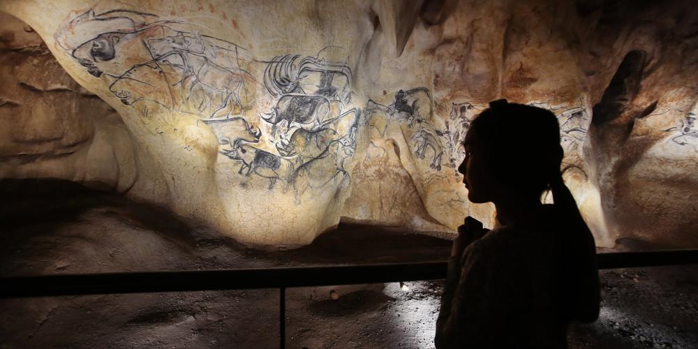 In the depths of a cave, the first artists in the history of Humanity painted a masterpiece: horses, lions, rhinos and other animals, captured in action. – © Patrick Aventurier