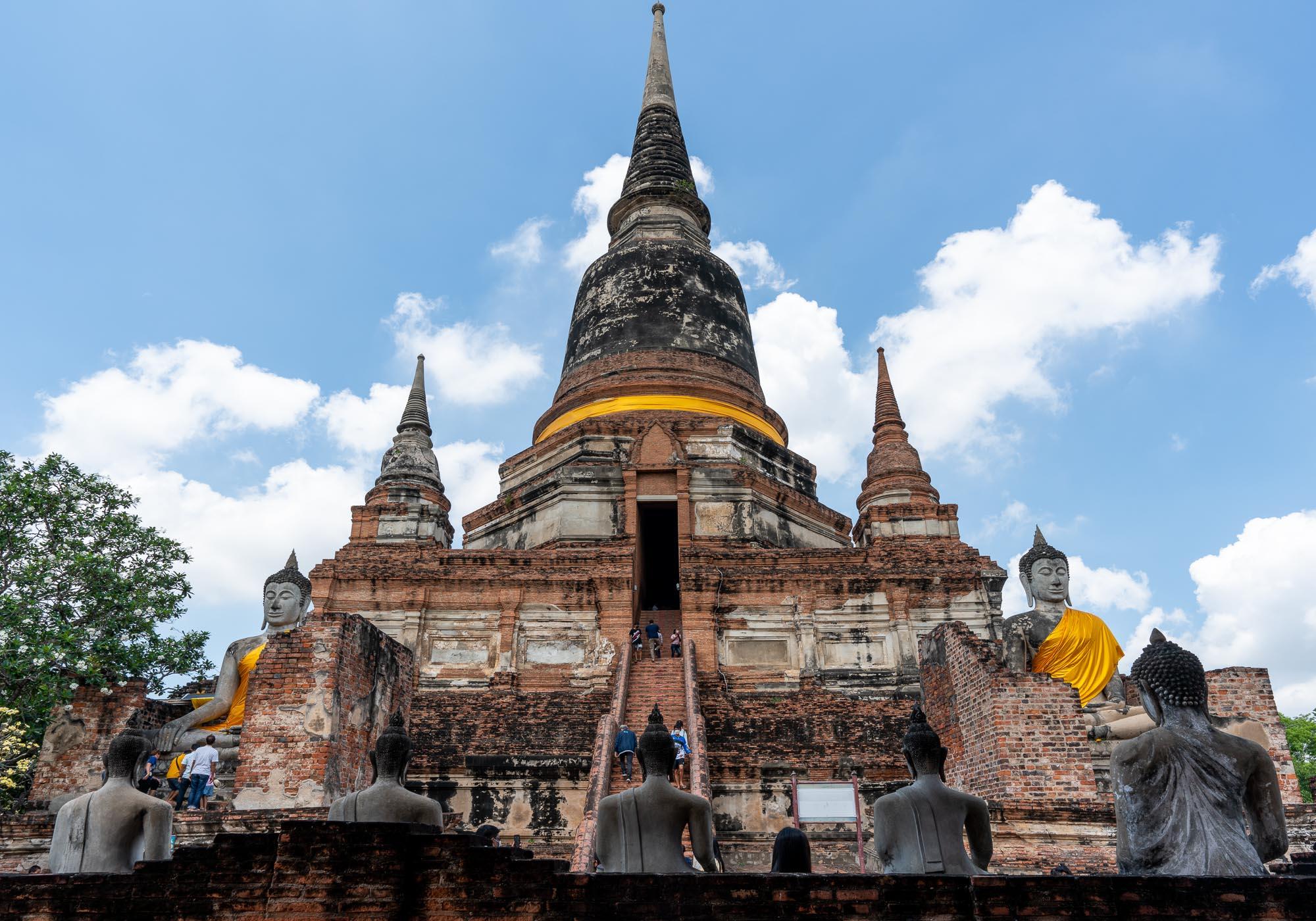 The restored temple of Wat Yai Chai Mongkhon has a soaring stupa surrounded by Buddha statues and is popular with worshippers. – © Michael Turtle