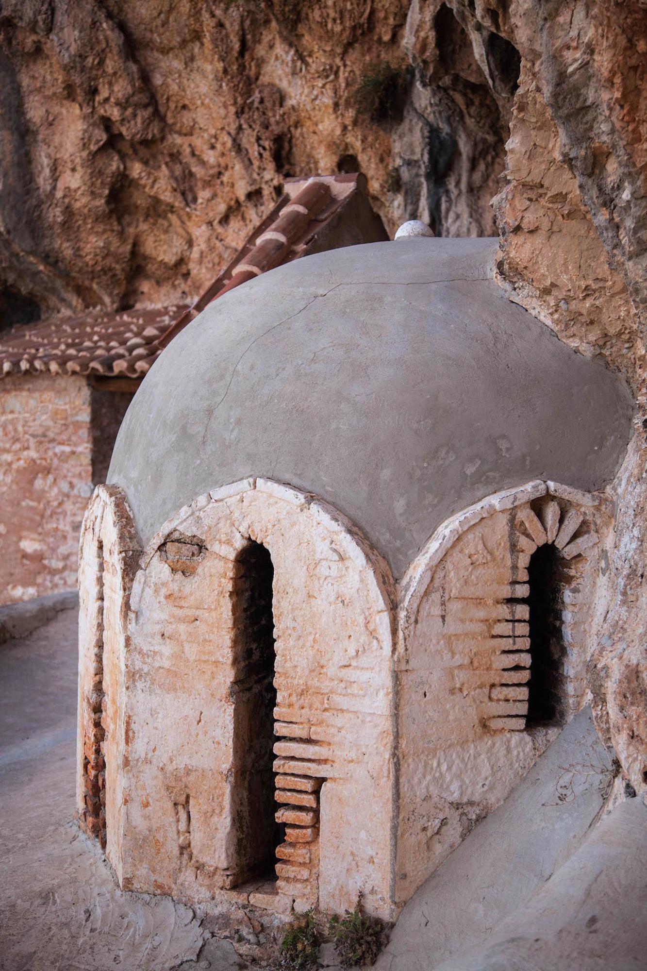 The monastery complex consists of many parts and areas that are shaped to fit into the hollows of the steep natural rock. - © Hellenic Ministry of Culture and Sports/Ephorate of Antiquities of Argolida
