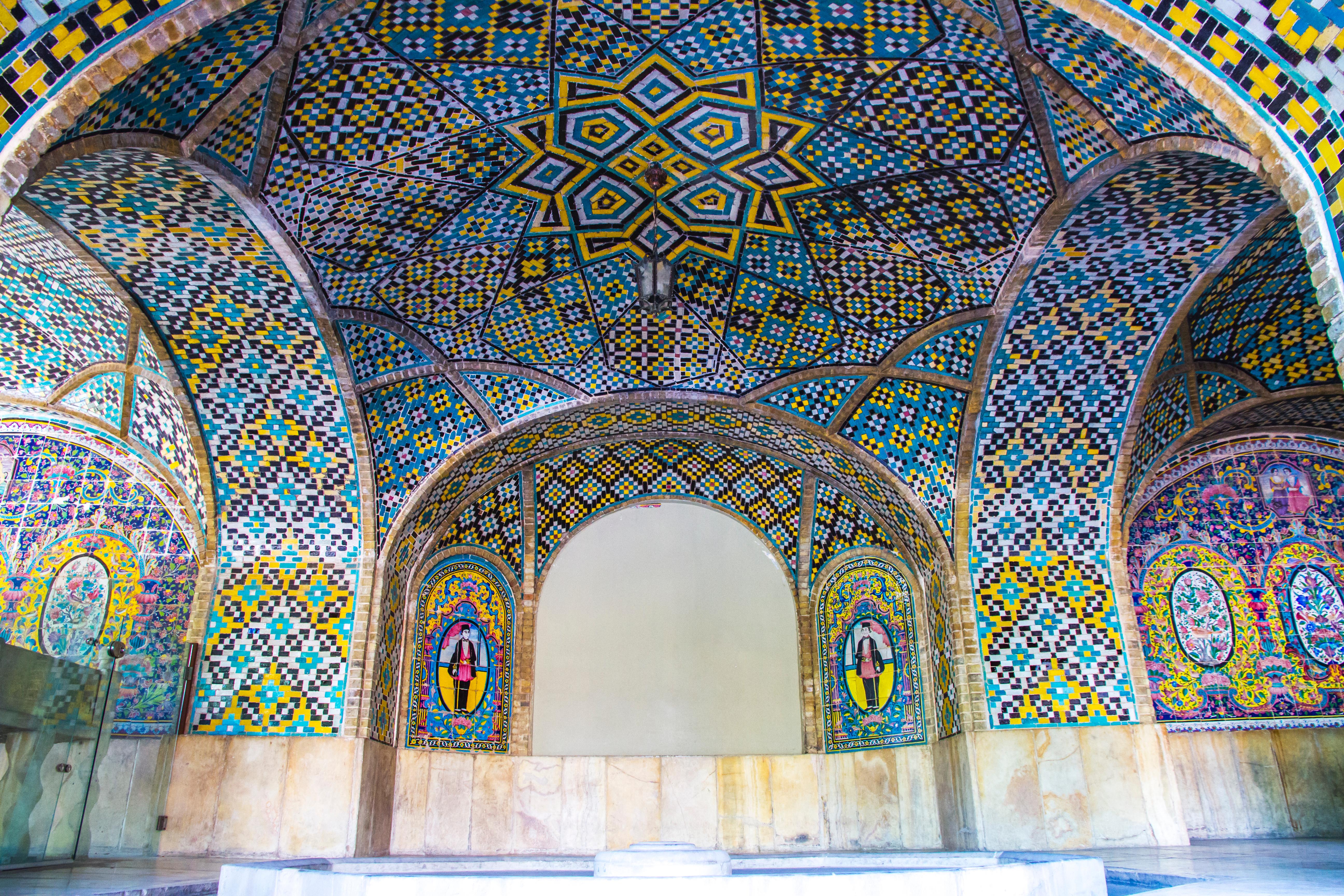 Arched ceiling adorned with colorful tiles at Golestan palace