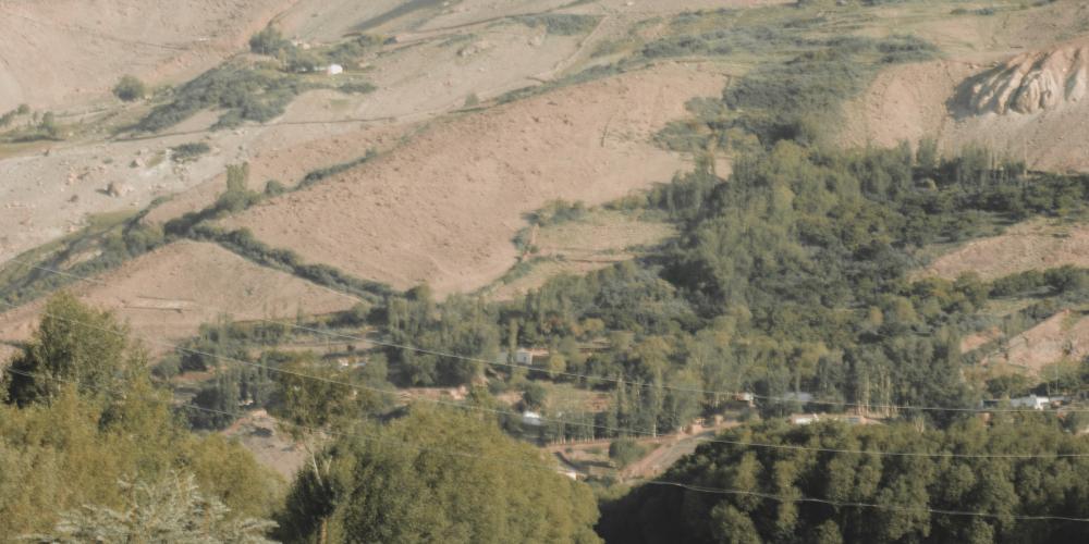 Local men having a conversation by a stream. © Ann Tachado – Photo by Ann Tachado Local men having a conversation by a stream. © Ann Tachado – Photo by Ann Tachado