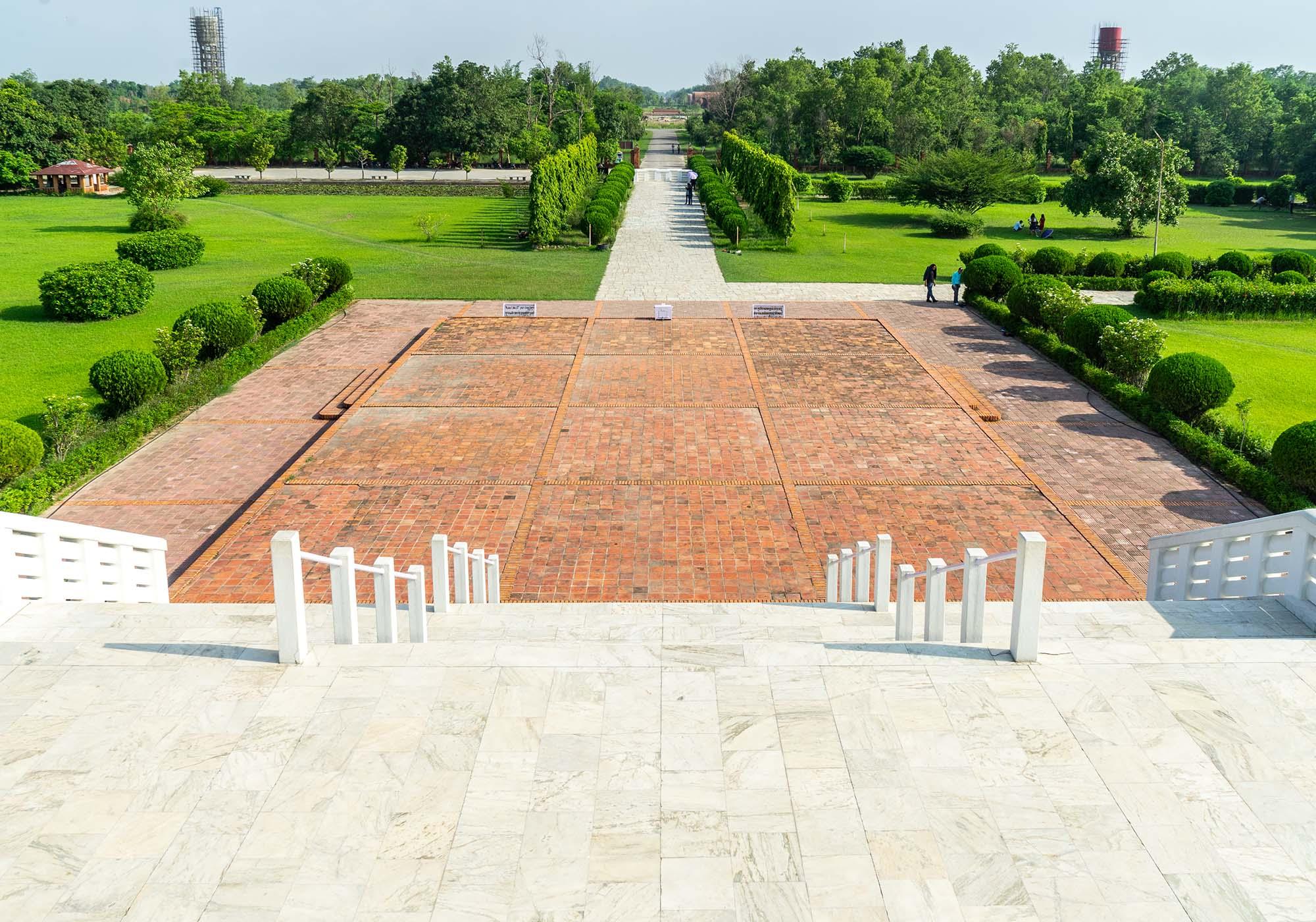 The view from the World Peace Pagoda down the central axis towards the Mayadevi Temple in the middle of the Sacred Garden. – © Michael Turtle