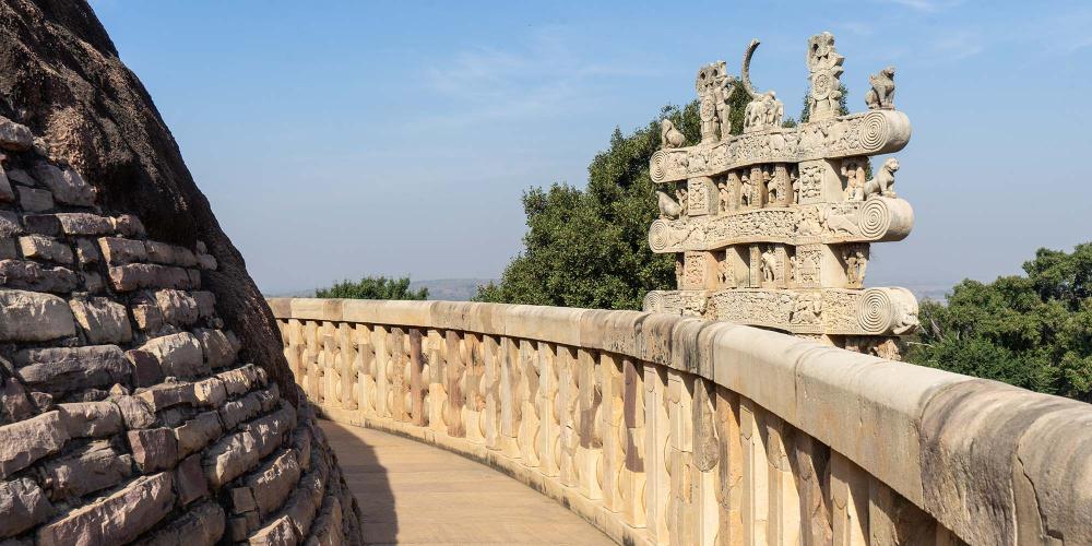 The high terrace that encircles the Great Stupa offers close-up views of the rears of the ornately-carved gateways. – © Michael Turtle The high terrace that encircles the Great Stupa offers close-up views of the rears of the ornately-carved gateways. – © Michael Turtle