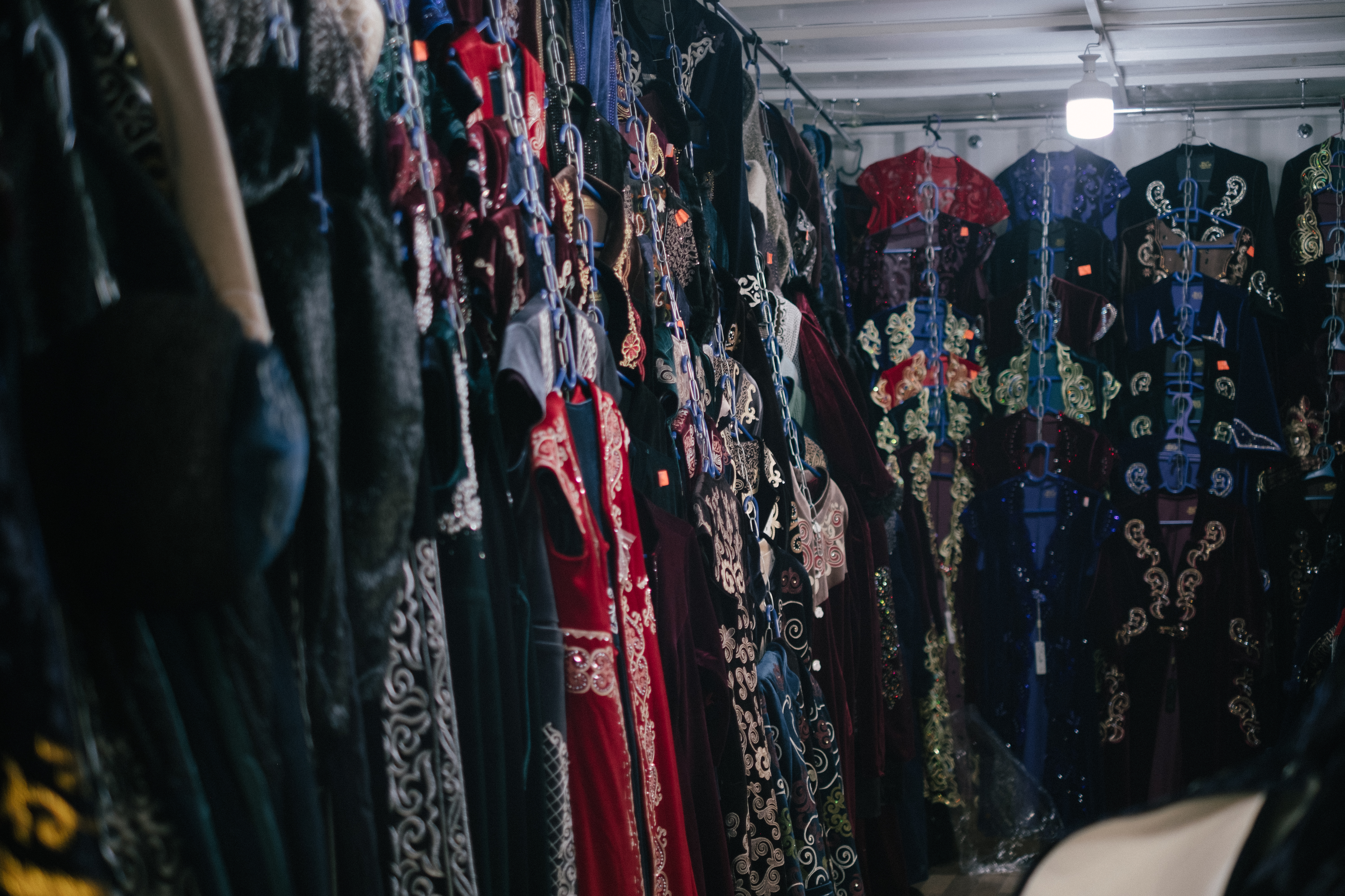 Traditional Kazakh clothing hanging in a store – © UNESCO