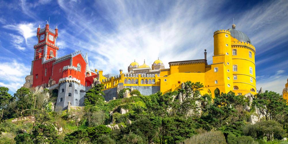 A view of the National Palace of Pena palace from below. The park and palace are Portugal’s greatest example of 19th century Romanticism. – © Goncalo Borba / Shutterstock