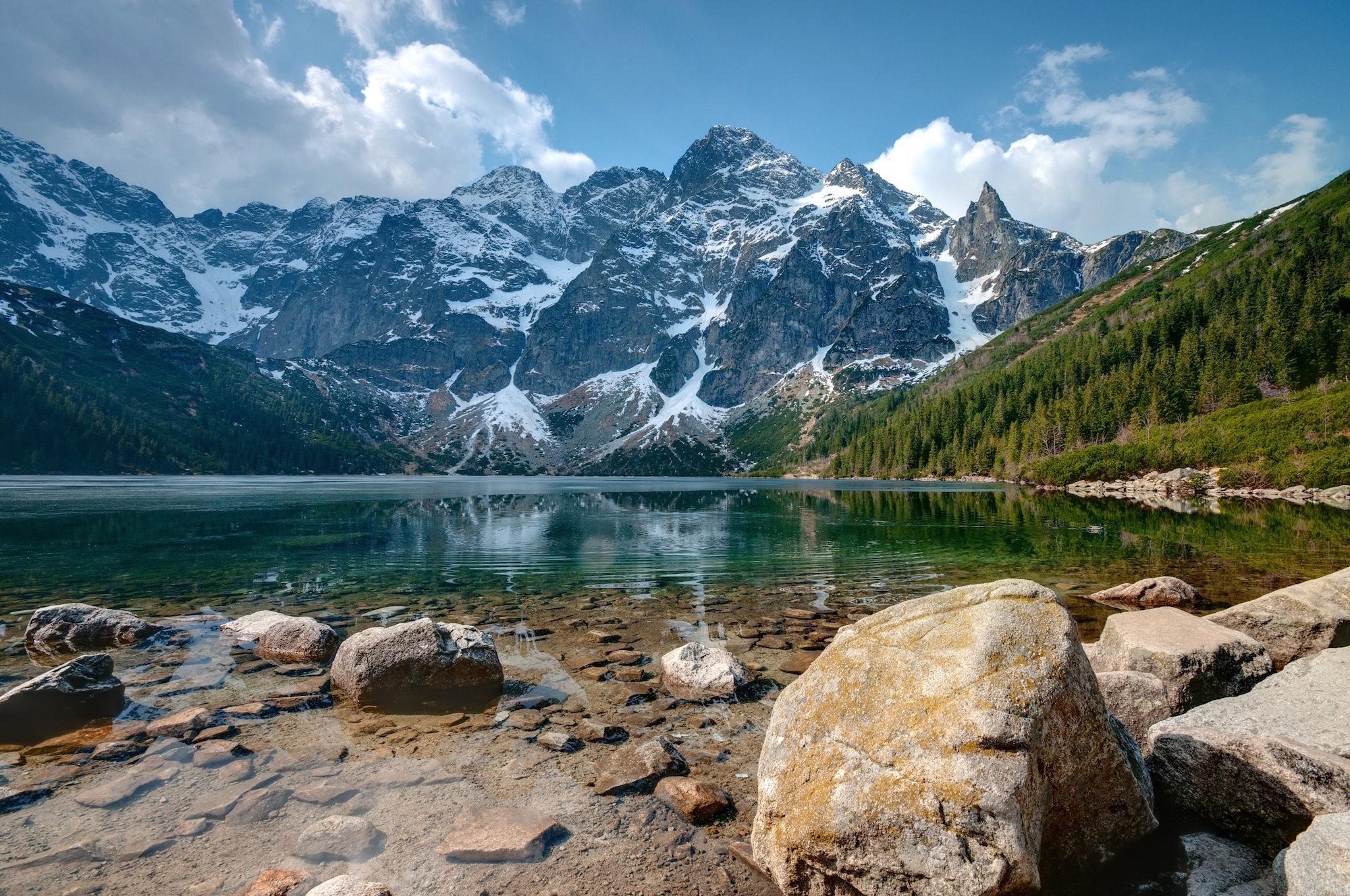 Morskie Oko Lake is the largest lake in the Tatra Mountains. On its banks is a historic mountain lodge, where you can have a meal or spend the night in cosy rooms and enjoy the breathtaking views. – © Albert Nowicki