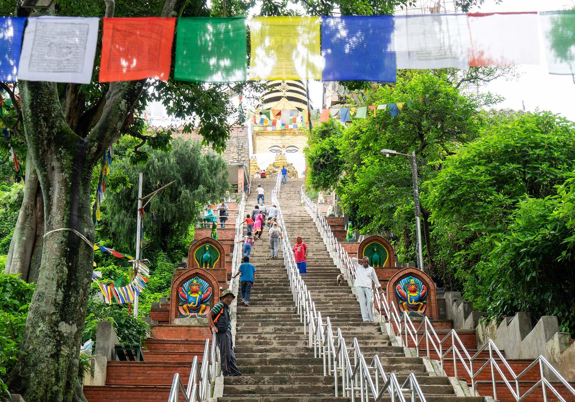 The climb up the 365-step staircase to the top of the hill at Swayambhunath is long but there are places to rest along the way. – © Michael Turtle