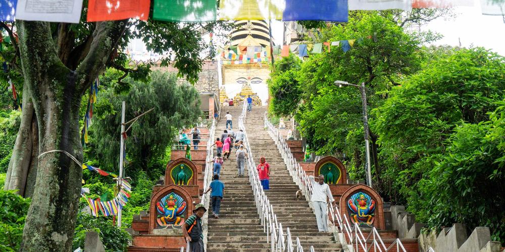 The climb up the 365-step staircase to the top of the hill at Swayambhunath is long but there are places to rest along the way. – © Michael Turtle The climb up the 365-step staircase to the top of the hill at Swayambhunath is long but there are places to rest along the way. – © Michael Turtle