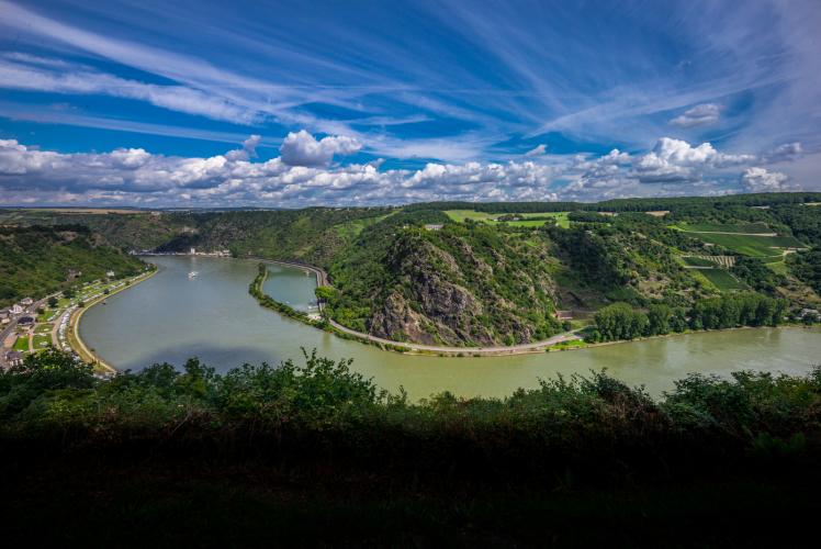 The distinctive Loreley Cliff, the Middle Rhine’s famous landmark, towers 125 meters above the river. According to the legend, Loreley used to sit here, combing her long blonde hair, and sending smitten sailors to their doom. – © Herbert Piel / Piel Media, Rheintouristik Tal der Loreley